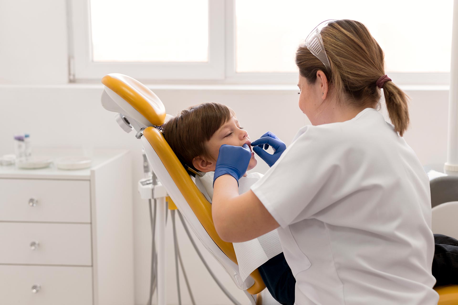 dentists at metrotown dentist cleaning child s teeth